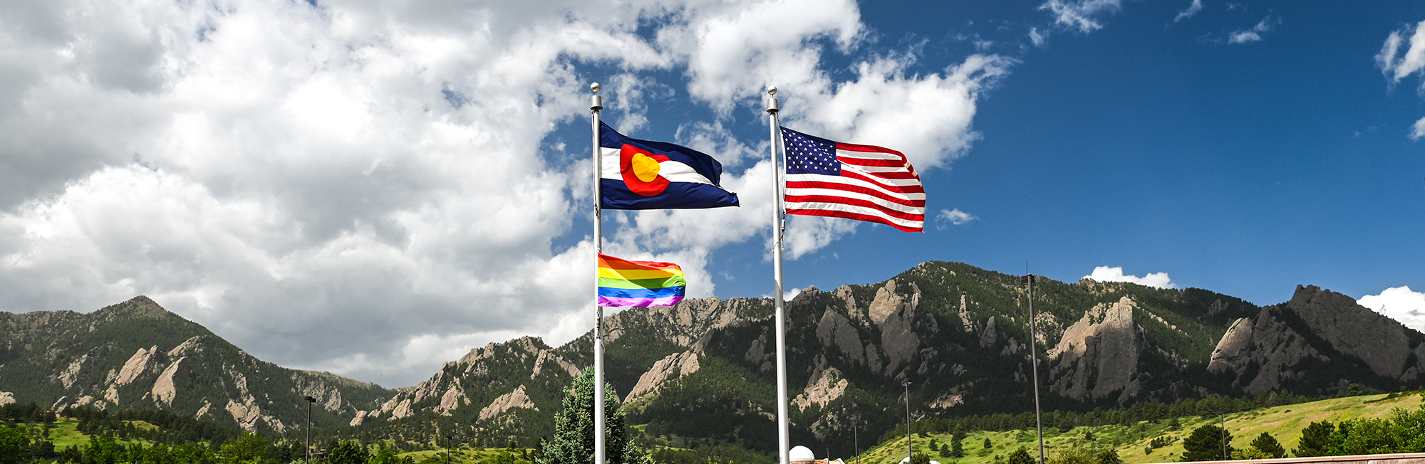 flag poles at the DSRC fly the United States of America flag, the State of Colorado flag, and the Pride flag