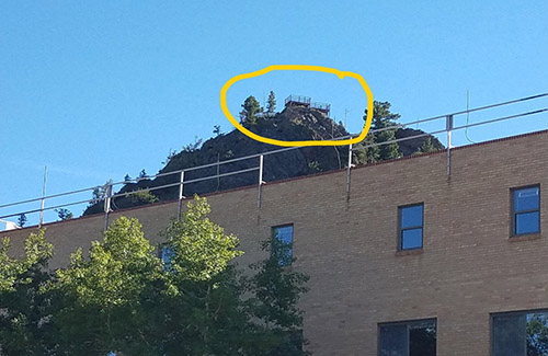 platform on mountain behind bldg