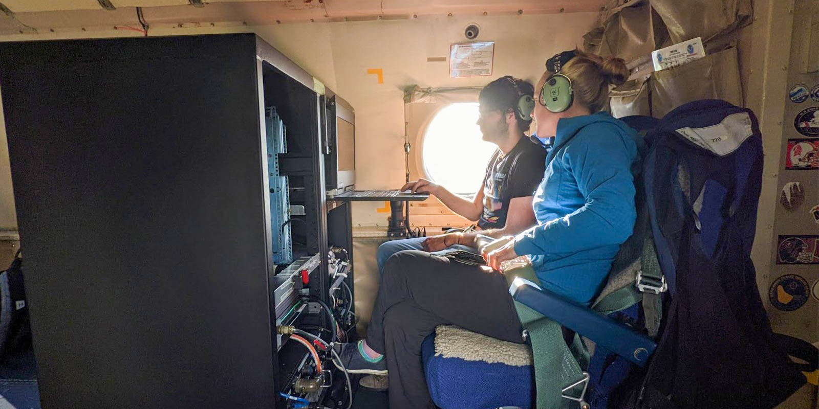 researchers aboard the NOAA WP-3D