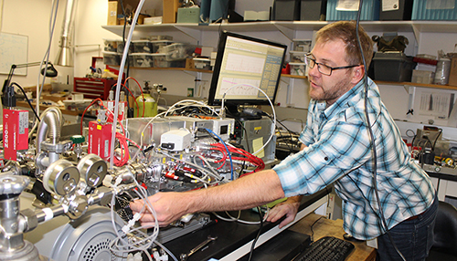 Patrick Veres with instrument in the NOAA lab